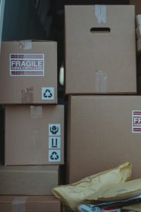 Cardboard boxes with fragile labels ready for shipping and storage solutions.