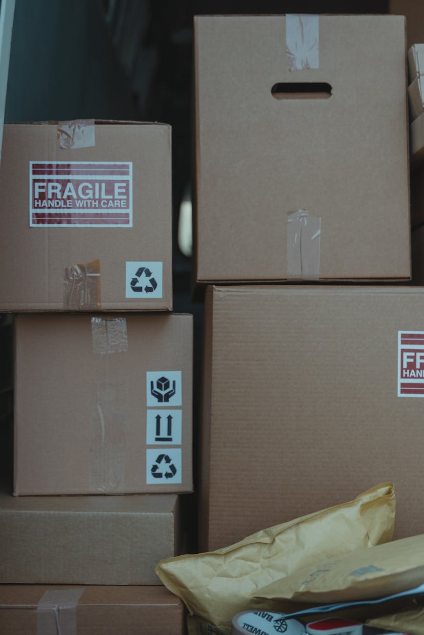 Cardboard boxes with fragile labels ready for shipping and storage solutions.